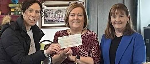Caroline Creighton and Sheila McCarty present Catherine McGrath, Elphin Day Centre, with a cheque for €750 from a fundraising carol service, in Croghan Church before Christmas. 