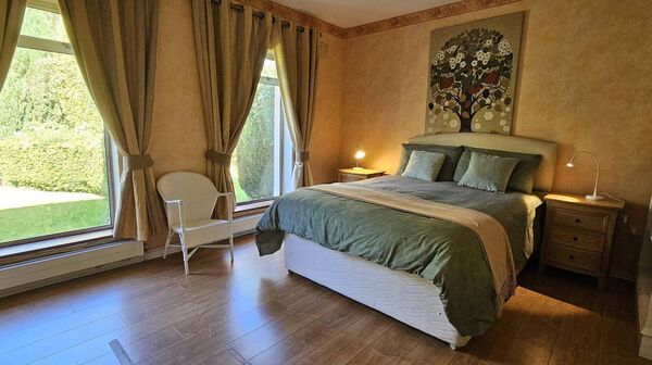 The opulent master bedroom is ensuite.