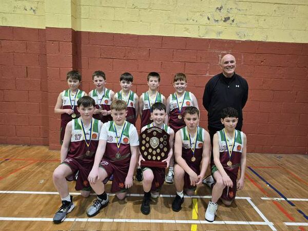 The Castlerea U-13 Roscommon Community Games basketball champions with trainer Joe Henry following their win over Croghan-Drumlion.