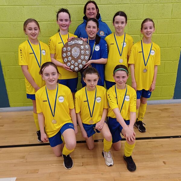 The U-13 girls' team from Taughmaconnell and their manager, Louisa Brooks, that were crowned Community Games indoor soccer champions in Strokestown. 