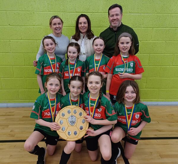 The U-10 girls' team from Kiltoom/Cam and their management of Bernice Mockler, Elaine Lennon, and Kenny Noonan that were crowned Community Games indoor soccer champions in Strokestown.