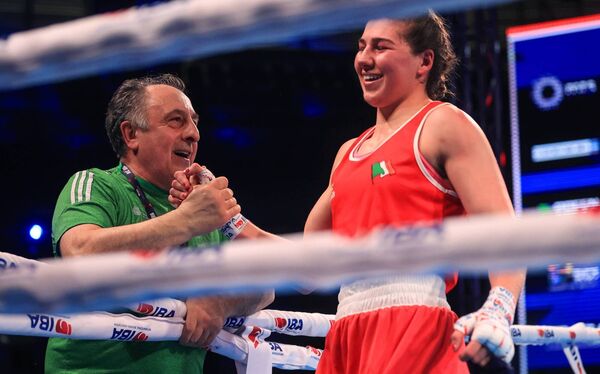 Aoife O’Rourke celebrates winning her 75kg semi-final with her coach Zaur Antia at the World Boxing Championships in Serbia on Friday afternoon. Picture: INPHO/Aleksandar Djorovic