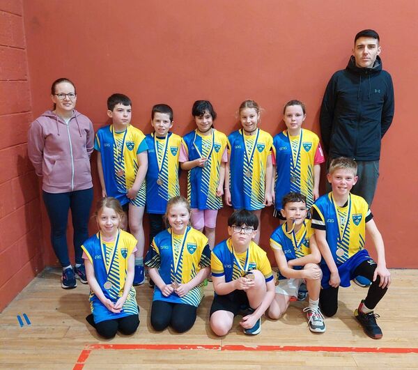 The U-11 mixed basketball team from Kiltullagh, and their management, that won silver medals at the Community Games finals in Castlerea.
