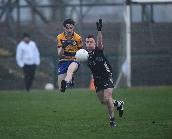 Roscommon corner-forward, John Price, battles for possession alongside Sligo corner-back, Conor Stenson, during Friday evening's provincial contest at King and Moffatt Dr. Hyde Park. Picture: Gerard O'Loughlin