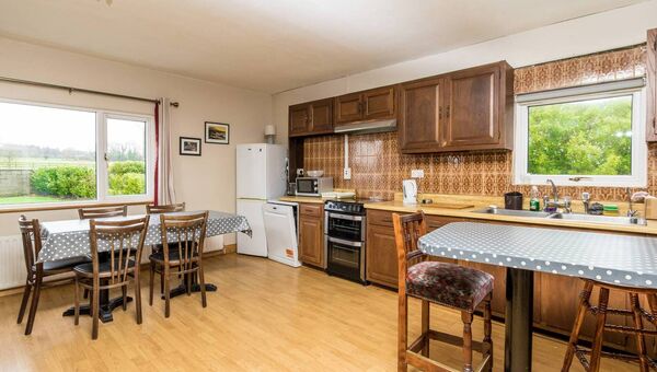 The kitchen is large and full of natural light. The kitchen is large and full of natural light.