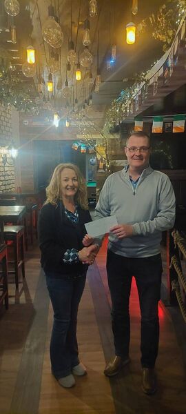 Committee member Lorcan Egan presenting the Overall Runner-Up (€200) prize at the Boyle St. Patrick’s Day Parade to Boyle Golf Club.
