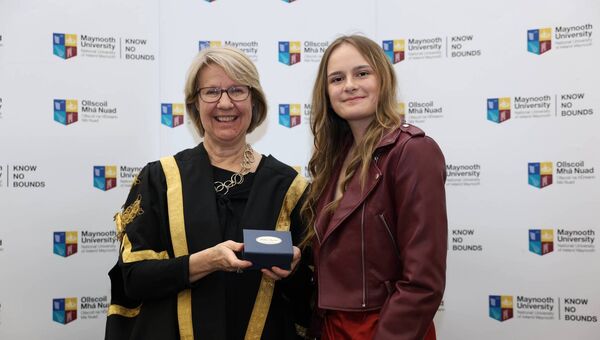 Former Coláiste Chiaráin, Athlone student Urte Tunaityte receiving her Maynooth University Entrance Scholarships from Maynooth University President Professor Eeva Leinonen. 