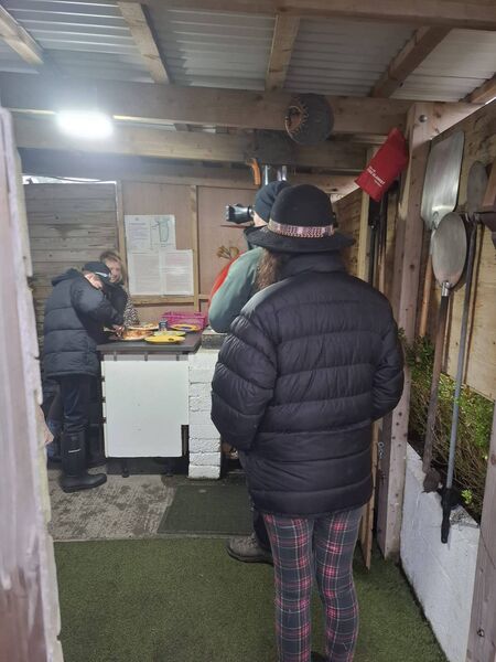 A teenager from inner city Dublin makes pizza in the Toto Schillaci pizza oven at Willowbrook Glamping and Hideaways.