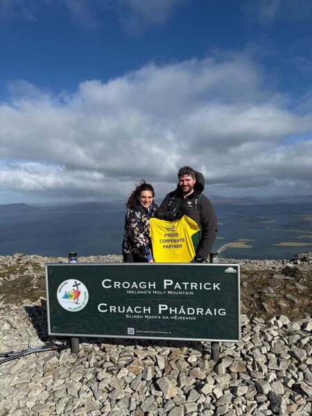 Boyle teacher Niall Flynn pictured with his wife Deirdre after climbing Croagh Patrick. Niall climbed the mountain six times in one day as part of his Six Challenges in Six Months fundraiser.