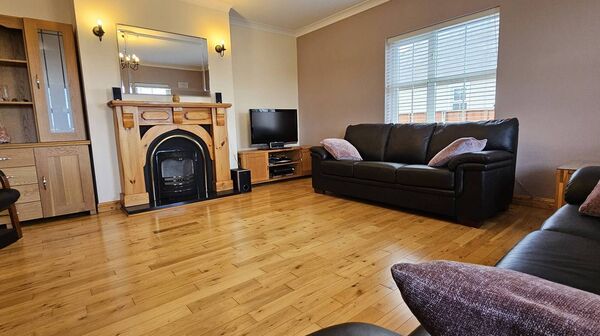 The living room with two dimensions of over five meters is well apportioned with solid oak flooring and an open fire. The living room with two dimensions of over five meters is well apportioned with solid oak flooring and an open fire.