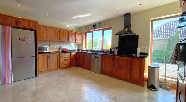 The generous accommodation includes a large kitchen/dining area.