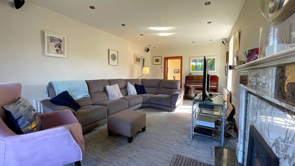 The sitting room is large and bright.