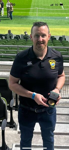 Ciarán McBrien, Carrick on Shannon RFC, with his Service To Rugby award in the Aviva Stadium last weekend. Ciarán McBrien, Carrick on Shannon RFC, with his Service To Rugby award in the Aviva Stadium last weekend.