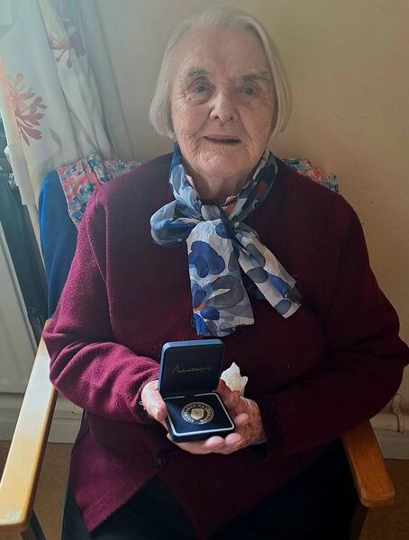 Eileen Cox with the medal she received from for President Michael D. Higgins in honour of her 101st birthday. 