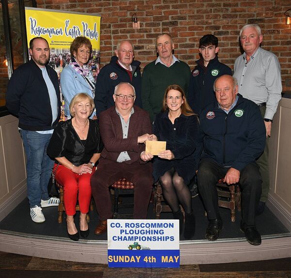 Roscommon Ploughing Association took the top prize for their float at the Roscommon Easter Parade. Picture shows Cllr Larry Brennan, chairperson Roscommon Easter Parade Committee, presenting the cheque to Martina Beirne, treasurer Roscommon Ploughing Association, at a presentation night in the Red Parrot Bar, Roscommon. Also in picture, front: Pauline Lavin and James Coffey. Back: Mark Molloy, asst. treasurer; Patricia Mullaney, treasurer; Paddy Beirne, Pat Naughton, Connor Furey, Roscommon Ploughing Association, and J.J. Cattigan, secretary Roscommon Easter Parade Committee. Pic: Gerard O’Loughlin
