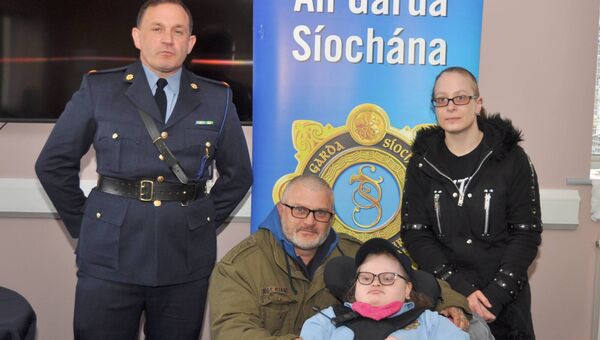 Jason, Caroline and Haley Bird with Inspector David Cryan as Haley (16) was made a Little Blue Hero at Castlerea Garda Station. Pic: Liam Reynolds