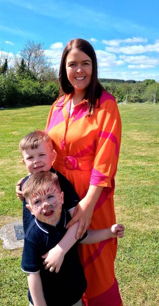 Teacher Cathy Martin pictured with her sons Conor and Luke at the celebrations marking the 75th anniversary of Drumboylan NS. Pic: Noreen Gaffney
                    
