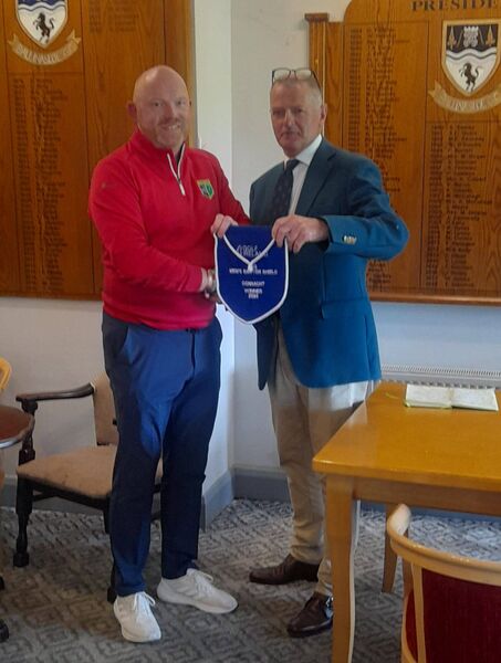 Roscommon Golf Club Captain, Enda Daly, receives the pendant from Pat Horkan, Connacht Region Executive Committee Golf Ireland Chairperson, to confirm his side as Connacht Barton Shield champions.