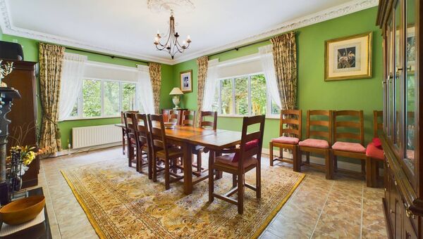 The dining room at Grouse Lodge is filled with natural light and overlooks the garden.