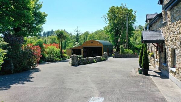 The property comes with a range of outbuildings.