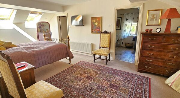 The master bedroom with en-suite fill with natural light.