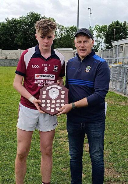 Boyle captain Callum Gavigan, accepts the shield from Roscommon GAA Minor Chairperson, Shay Galvin. Picture: Roscommon GAA