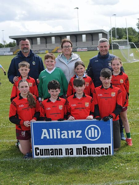 HISTORY-MAKERS: The Cloonbonniffe NS team, teachers and coaches that retained their Cumann na mBunscol football title on the eve of the school's 150th anniversary. Picture: Gerard O'Loughlin