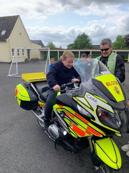 There was a very long queue to sit on the Blood Bank motorcycle called "Cara" when Abbeycartron NS welcomed Brian and Rossa from Blood Bikes West recently. 