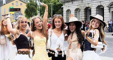 In photos: Crowds enjoy sunshine on year's hottest day ahead of busy weekend of events