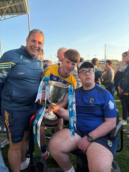 Adam Reddington with Ronan Carr and his father Tom following the Roscommon minor footballers' provincial final success in Castlebar. Adam Reddington with Ronan Carr and his father Tom following the Roscommon minor footballers' provincial final success in Castlebar.