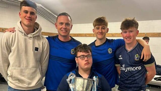 <p>Luke Shally, manager Shane Moran, Marc Shally and Rory Connolly celebrate with Adam Reddington and the Tom Kilcoyne Cup following the Roscommon minor football panel's Connacht final success against Mayo.</p>