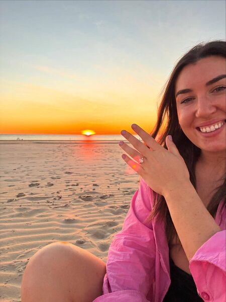 Joanne proudly displaying her engagement ring.