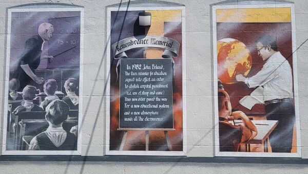 The mural is in remembrance of the abolition of corporal punishment in 1982.