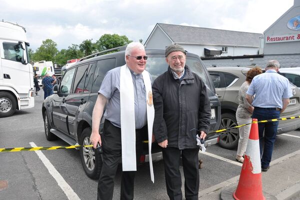 Fr Michael Donnelly gets the show on the road helped by Connie Farrell at the recent Pat McCrann Memorial Truck Run from Frenchpark to Strokestown in aid of the Frenchpark Church Restoration Fund. Pic: Liam Reynolds
