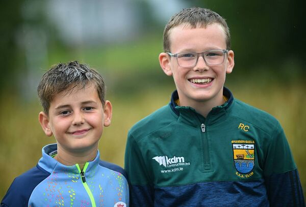 Cillian O'Dowd and Riley Cosgrove supporting Shannon Gaels during last Saturday evening's intermediate football championship game against St. Brigid's in Croghan. Picture: Gerard O'Loughlin