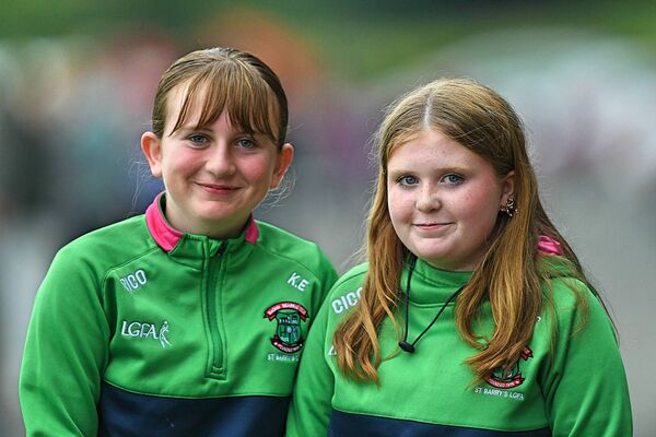 St. Barry's supporters, Ella Callaghan and Katie Earley, at Saturday evening's intermediate football championship clash against Creggs in Tarmonbarry. Picture: Gerard O'Loughlin
