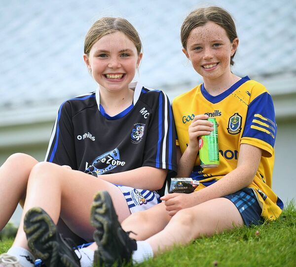 Mia Connaughton and Gráinne Naughton supporting the St. Dominic's senior hurlers during their championship game against Oran in Woodmount on Sunday last. Picture: Gerard O'Loughlin