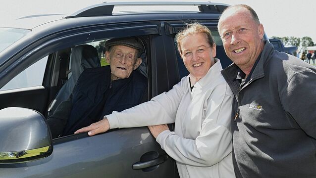 <p>Tom Mulry with his daughter-in-law Angela and son Mark at the Irish National Sheepdog Trials in Brideswell. Pic: Gerard O’Loughlin</p>