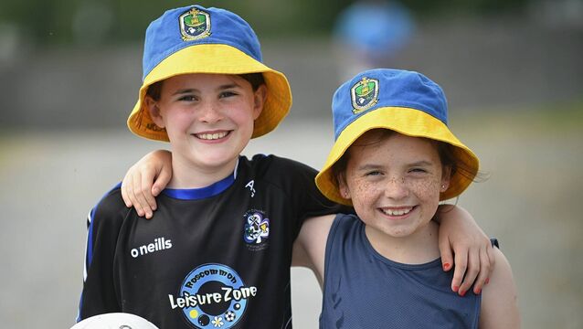 <p>Ava Gilleran and Anna Casey supporting St. Dominic’s during last Sunday's senior football championship match against St. Faithleach's in Knockcroghery. Picture: Gerard O'Loughlin</p>