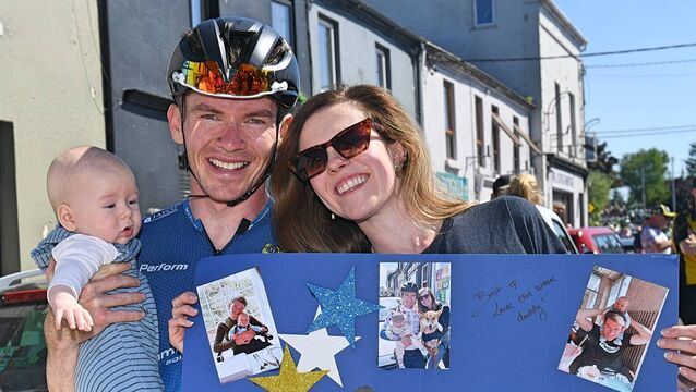 <p>Daire Feeley with wife Olivia and son Liam following the opening stage of the Rás Tailteann in Boyle earlier this year. Picture: Gerard O'Loughlin</p>
