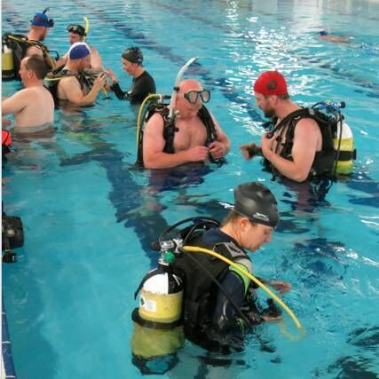 Pictured are people taking their first diving steps during a "Try a Dive" session. Pictured are people taking their first diving steps during a "Try a Dive" session.