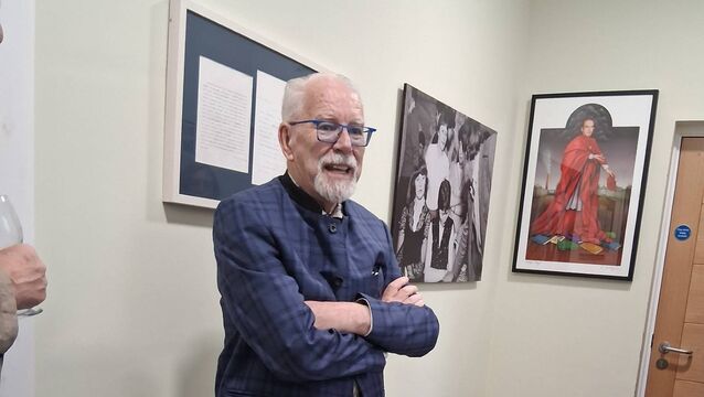 <p>Renowned artist Robert Ballagh pictured in the McGahern Barracks Museum giving a short talk on the background of the framed print he donated (on the right).  Pic: Noreen Gaffney</p>
