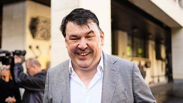Father Ted creator Linehan arrives at court for trans activist harassment trial