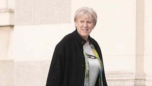 Woman arrested over serious online threats toward Simon Harris and his family