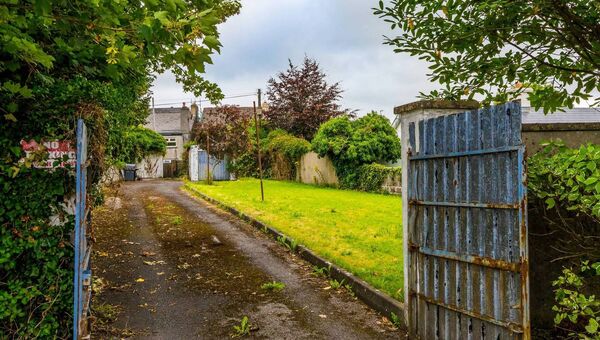 Outside, the property sits on a generous plot, surrounded by a mature garden. Outside, the property sits on a generous plot, surrounded by a mature garden.