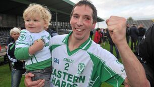 <p>Shamrock Gaels senior football manager, Shane King, with his son Ben after captaining Eastern Harps to Sligo senior football championship glory in 2010. </p>