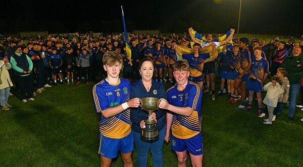 Clann na nGael U-16 joint captains, Bobby Lenehan and Luke Dunning, accept the Division One Cup from Roscommon Minor Board Vice-Chairperson, Paula Clogher, following their side's victory against St. Brigid's in the recent final at Woodmount. Picture: Gerard O'Loughlin