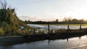 <p>On the Croghan Road outside Carrick-on-Shannon, flooding in fields overwhelms the drain taking it to the Shannon with overflow encroaching onto the roadway. Pic: Gerry Faughnan </p>