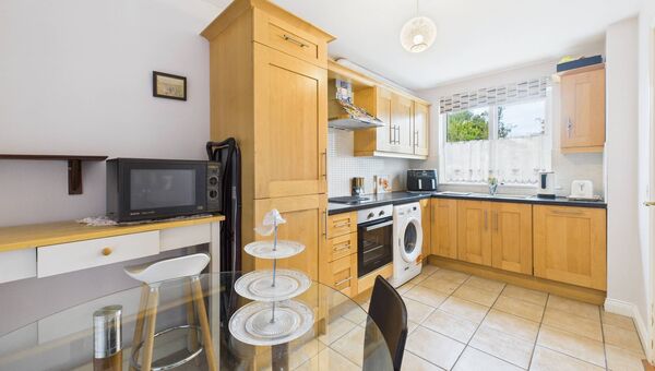 The bright and spacious kitchen is fully tiled. The bright and spacious kitchen is fully tiled.