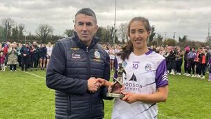 <p>Player of the Match Niamh Watson is presented with her award by Roscommon Camogie Chairperson Kieran Kenny. Picture: Roscommon Camogie.</p>